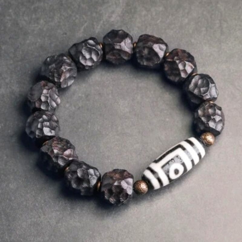 Amitabha - Bracelet en ébène sculpté et perle Dzi