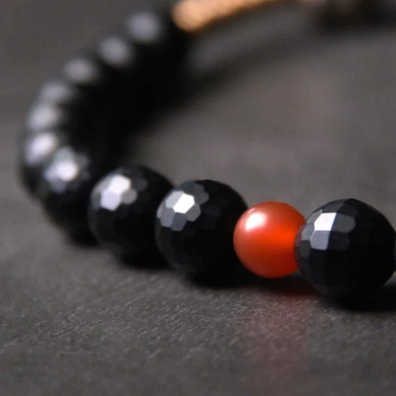 Kalachakra - Bracelet en onyx facetté, perle dzi et cuivre tibétain