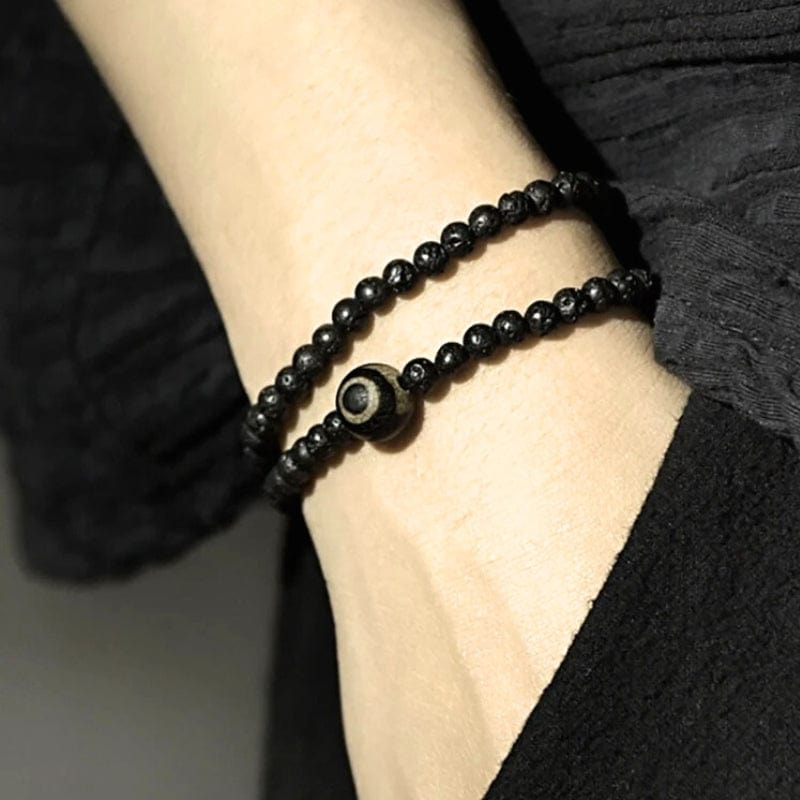 Ashva - Bracelet tibétain en pierre de lave et perle Dzi